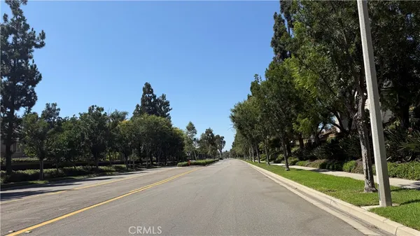 a view of a road with a yard
