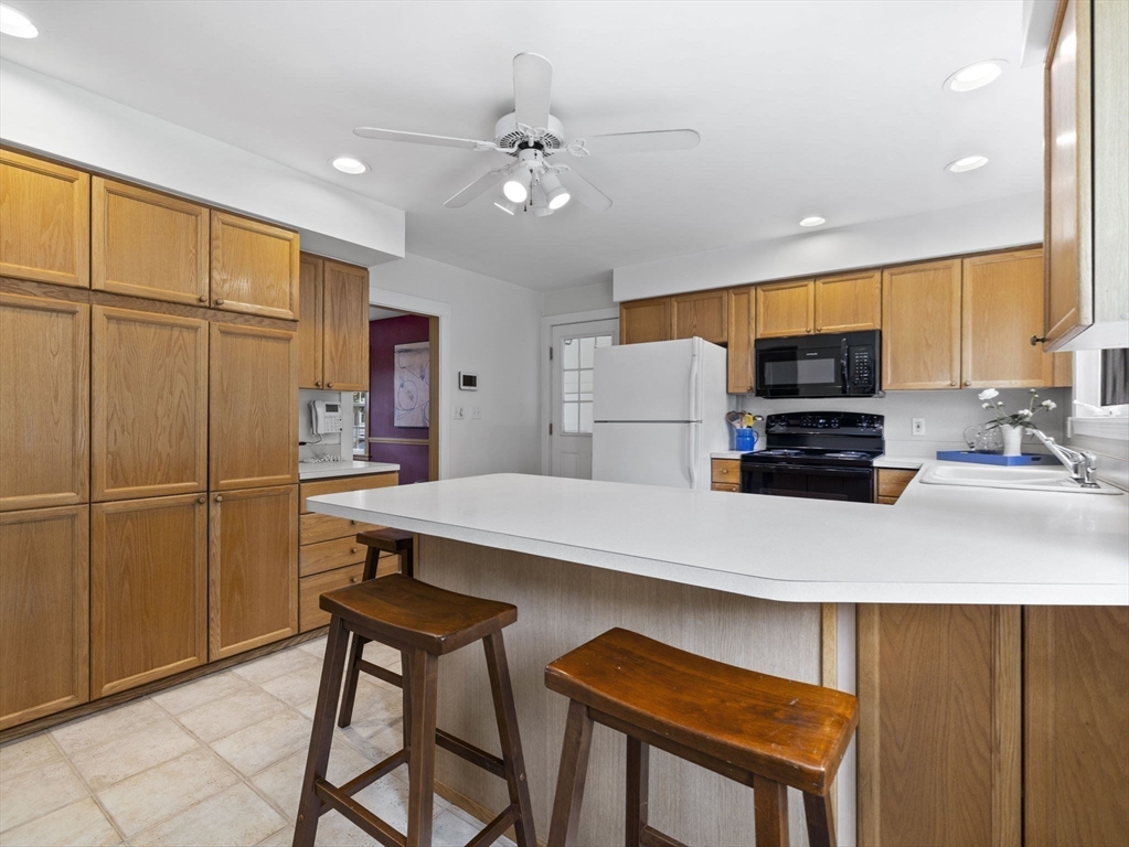 35 Winter Street Framingham, MA 01702 - Photo 11 of 22 a kitchen with stainless steel appliances a refrigerator and microwave