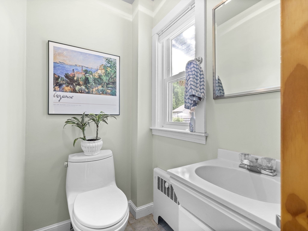 35 Winter Street Framingham, MA 01702 - Photo 12 of 22 a bathroom with a toilet a sink and a window