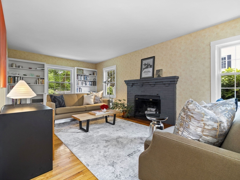 35 Winter Street Framingham, MA 01702 - Photo 3 of 22 a living room with furniture and a fireplace