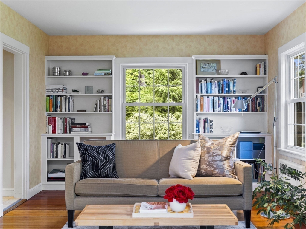 35 Winter Street Framingham, MA 01702 - Photo 4 of 22 a living room with furniture and a book shelf