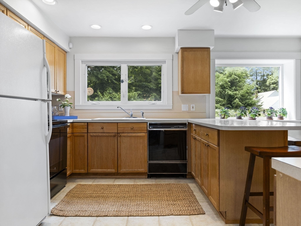 35 Winter Street Framingham, MA 01702 - Photo 10 of 22 a kitchen with a sink stove and refrigerator