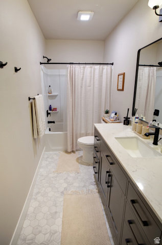 983 South 950 West Provo, UT 84601 - Photo 35 of 56 Bathroom featuring a hexagon tile floor, a shower-over-tub combination, and a dark wood-finish vanity with a light countertop