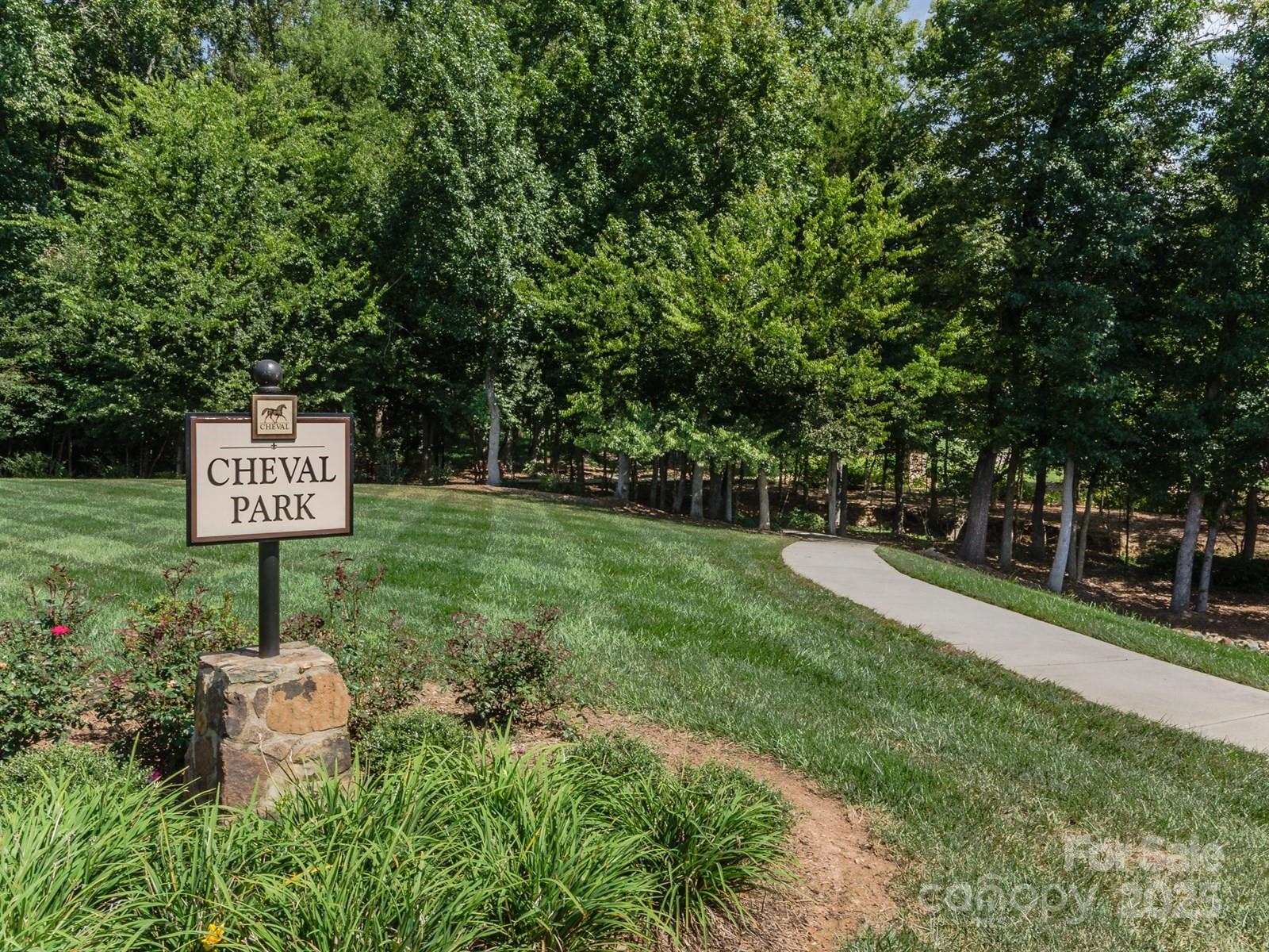 6639 Joli Cheval Lane, Unit 4 Mint Hill, NC 28227 - Photo 12 of 18 a sign board with a house in the background