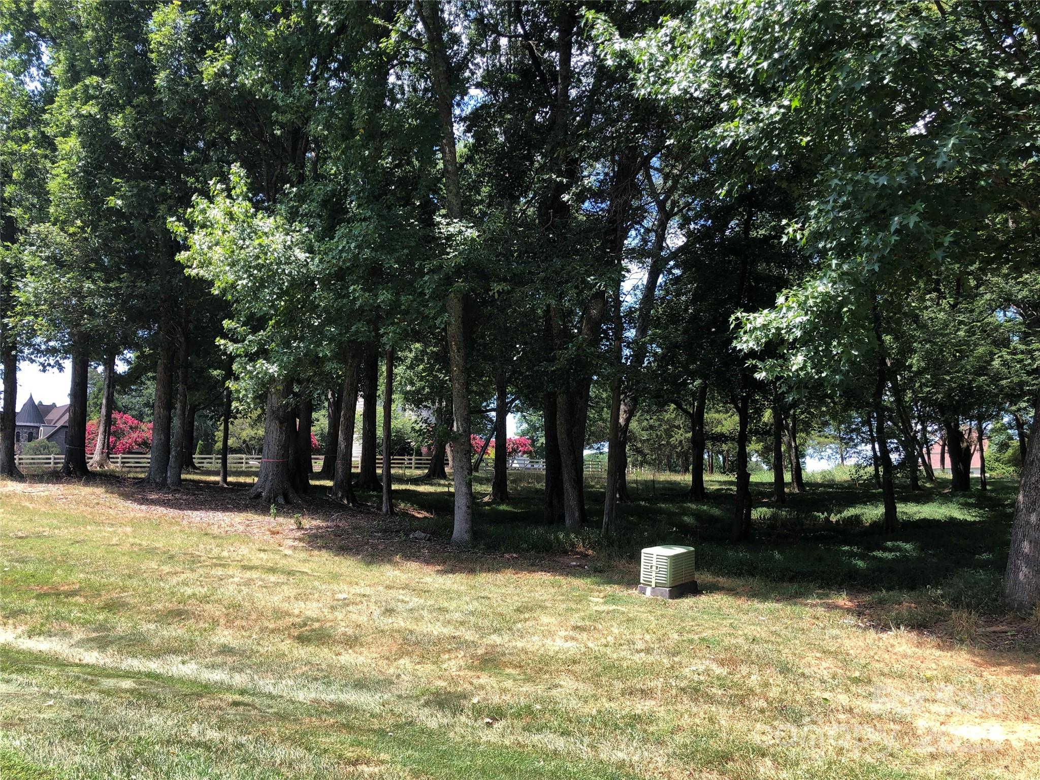 6639 Joli Cheval Lane, Unit 4 Mint Hill, NC 28227 - Photo 3 of 18 a swimming pool with outdoor seating and yard