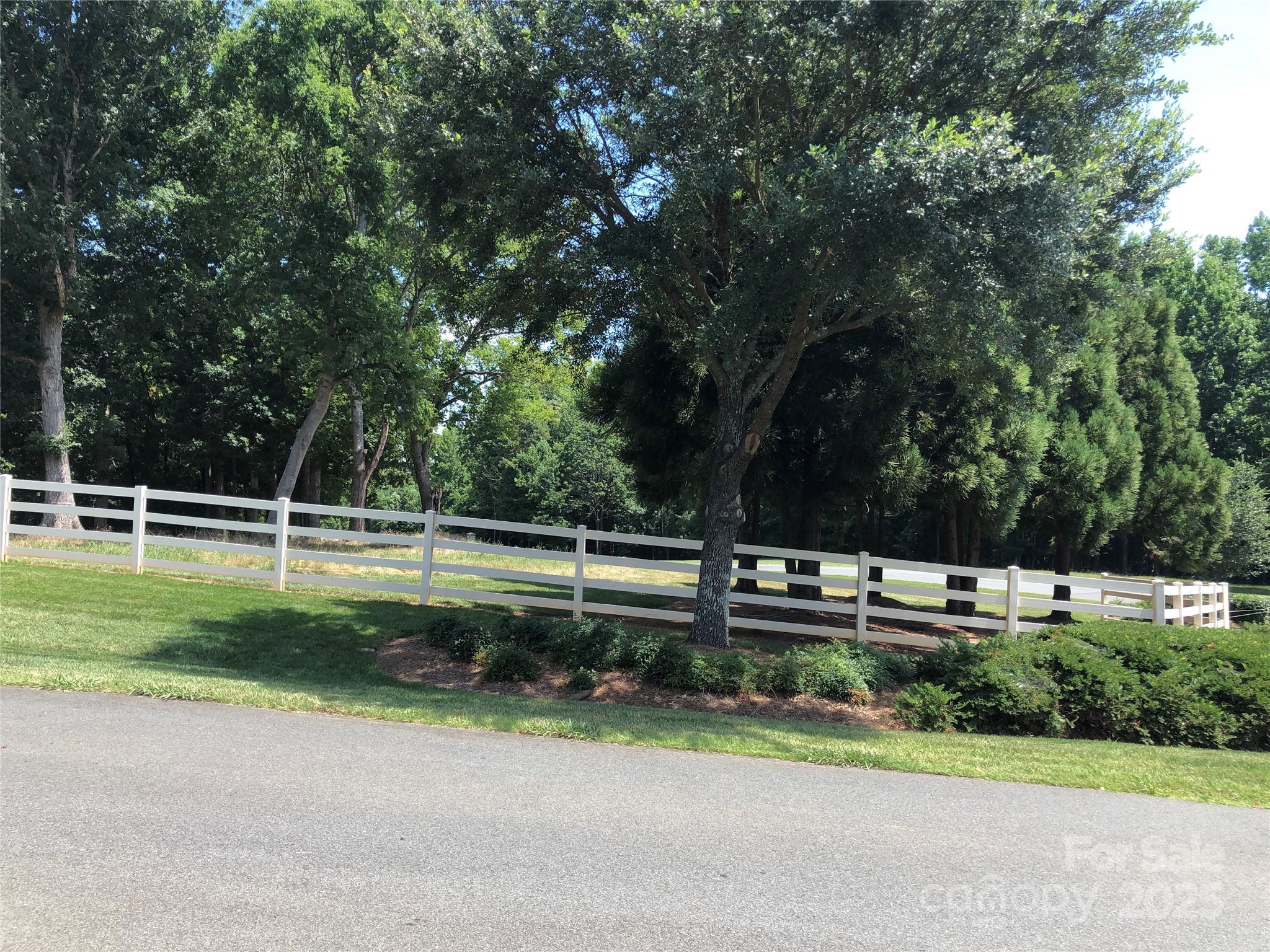 6639 Joli Cheval Lane, Unit 4 Mint Hill, NC 28227 - Photo 7 of 18 a view of a yard with a street