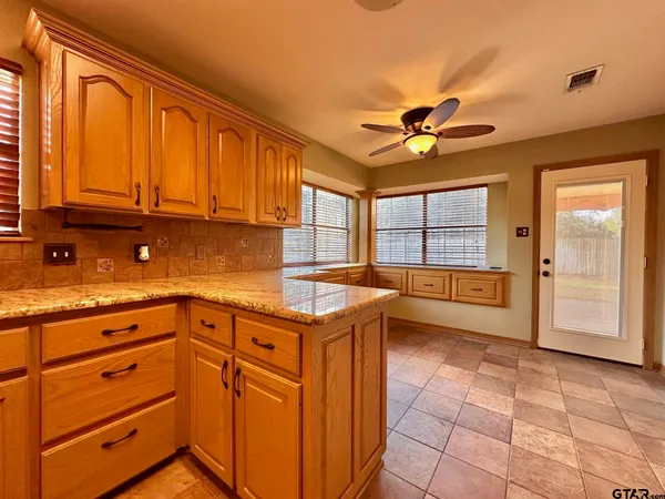 a kitchen with a cabinets and outdoor space