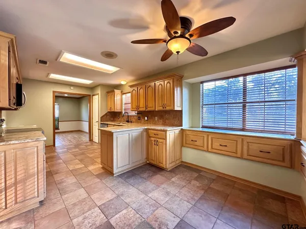 a kitchen with a stove a sink and a refrigerator