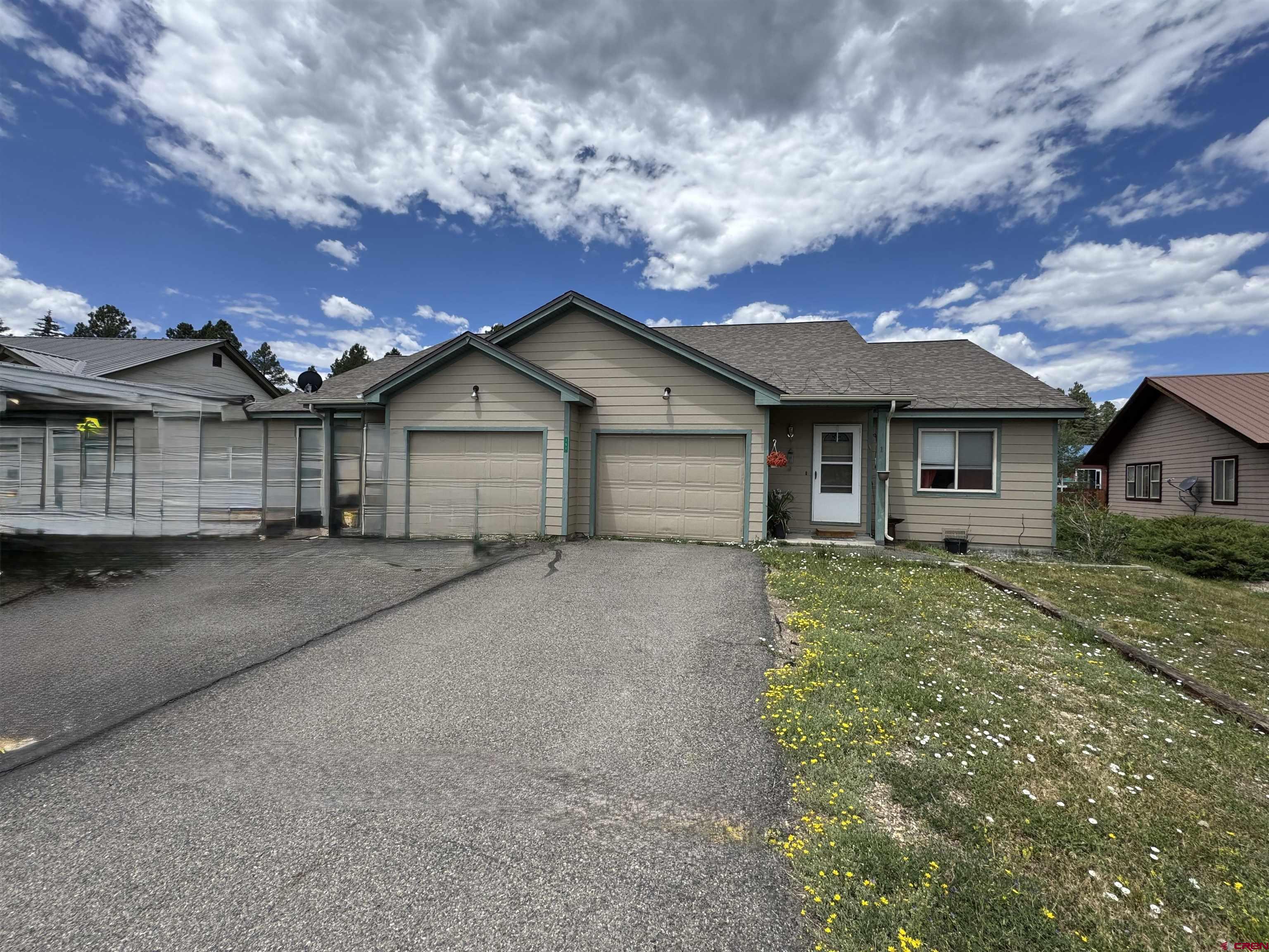 151 Butte Drive Pagosa Springs, CO 81147 - Photo 2 of 5 front view of house with a yard