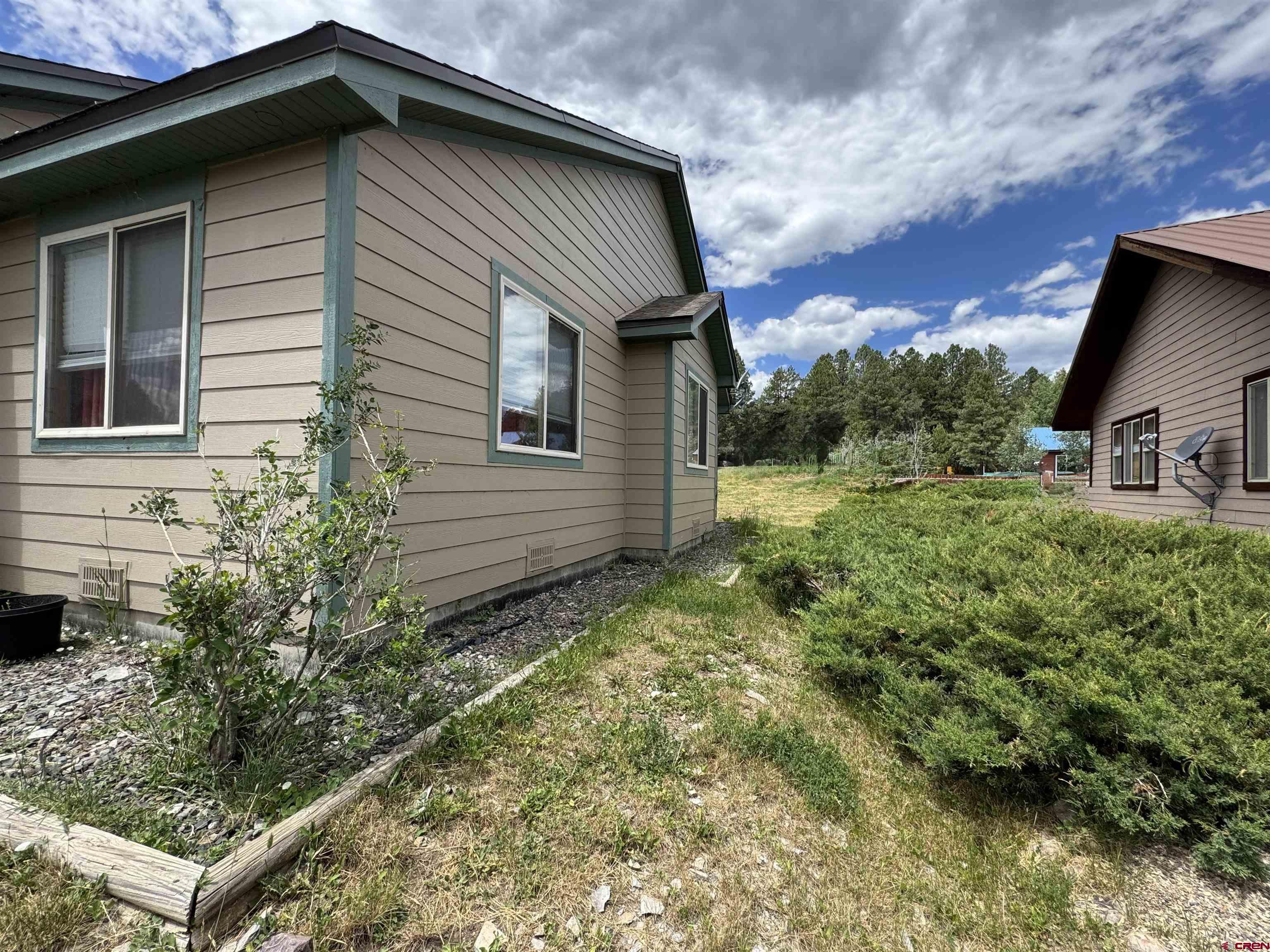 151 Butte Drive Pagosa Springs, CO 81147 - Photo 3 of 5 a view of a house with a yard