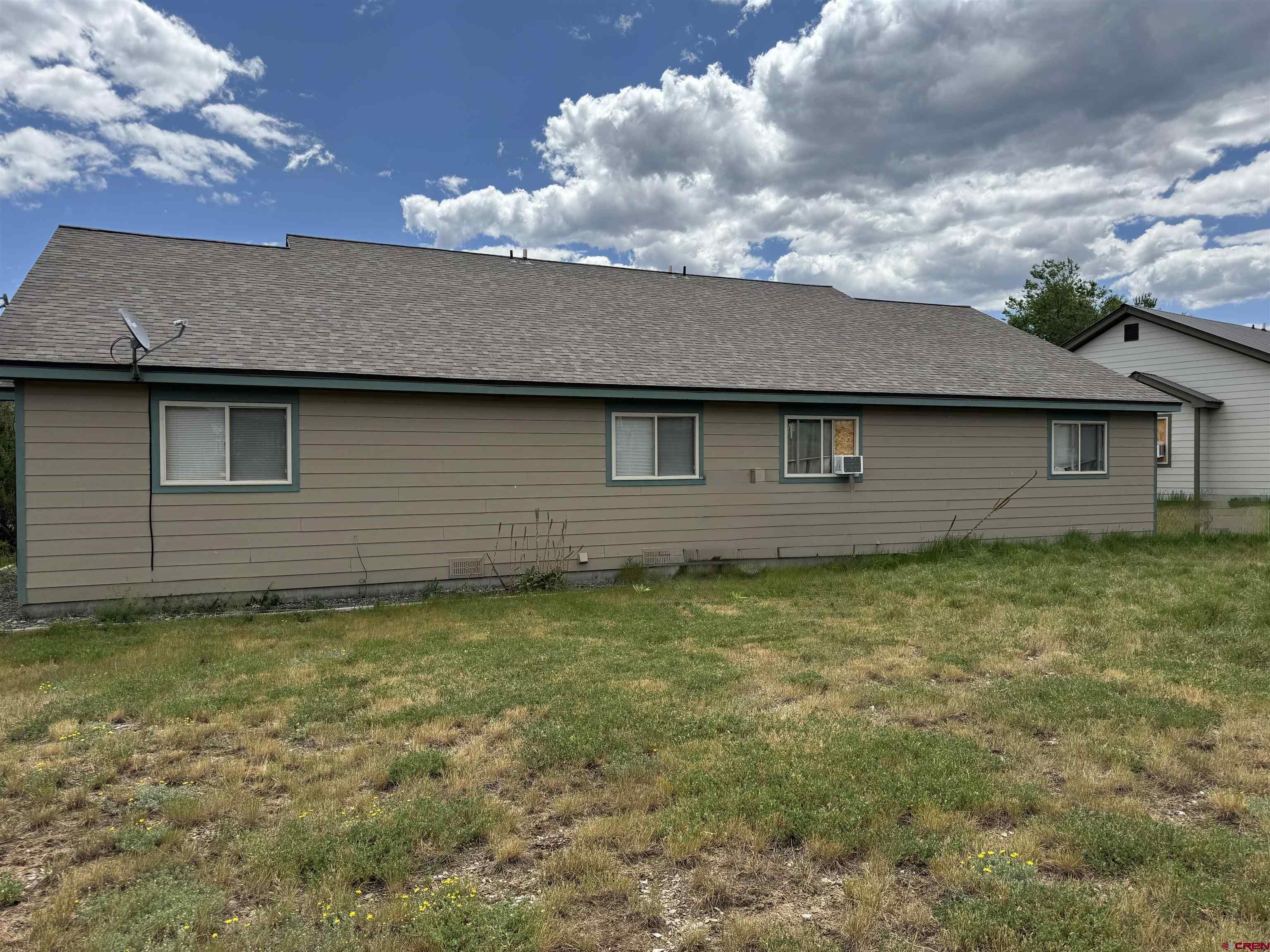 151 Butte Drive Pagosa Springs, CO 81147 - Photo 4 of 5 a backyard of a house