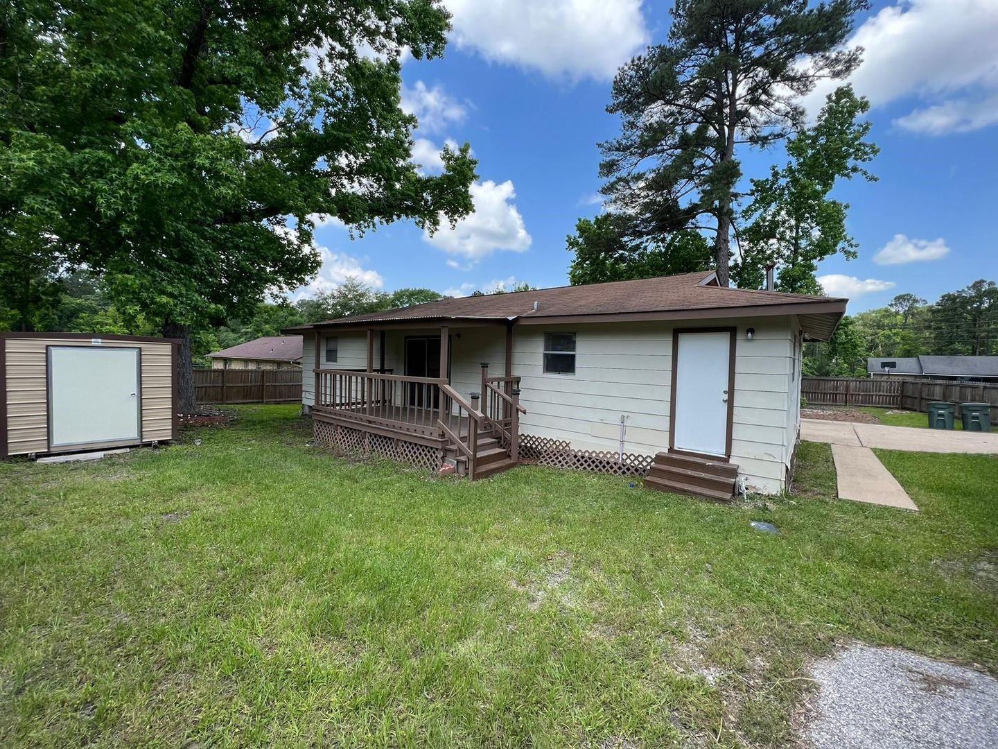 3058 Old Colony Road Huntsville, TX 77320 - Photo 14 of 14 a front view of a house with a garden