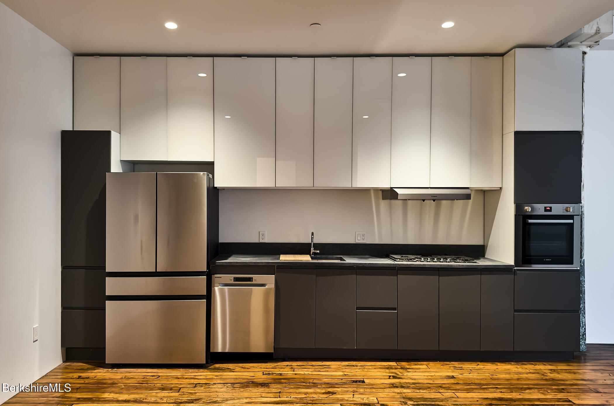 520 State Road, Unit 206 North Adams, MA 01247 - Photo 5 of 16 a kitchen with a refrigerator and a stove