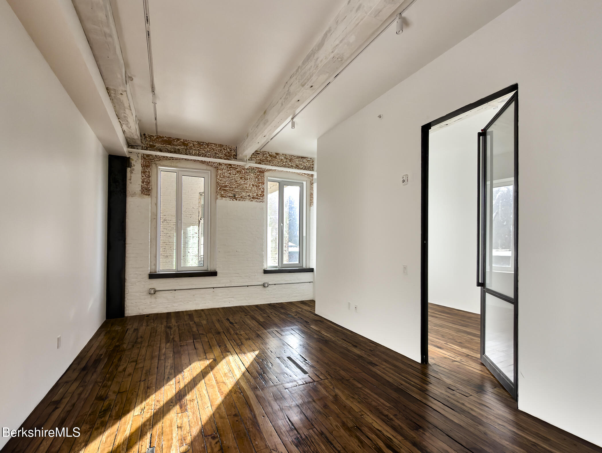 520 State Road, Unit 206 North Adams, MA 01247 - Photo 8 of 16 a view of empty room with wooden floor