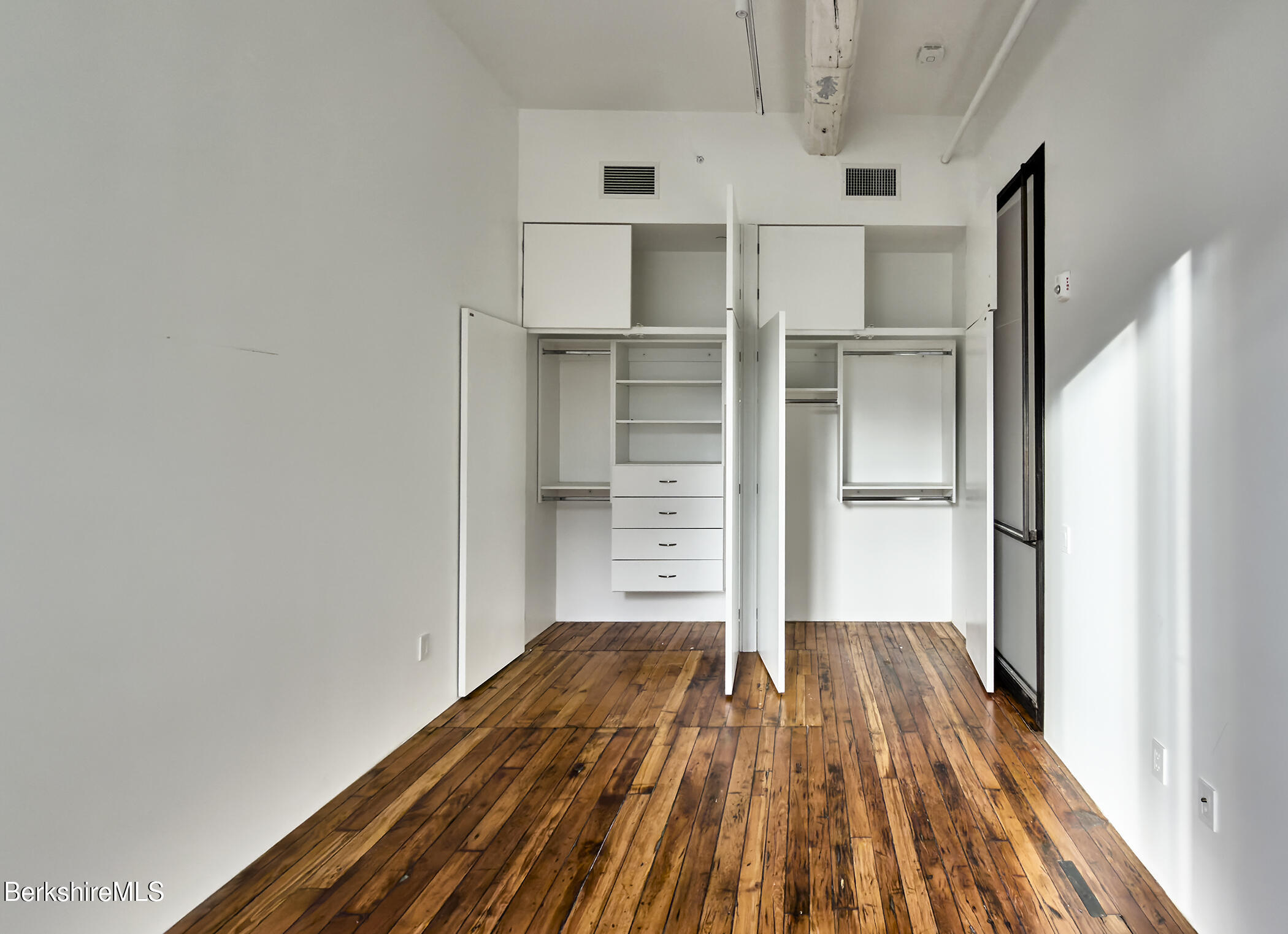 520 State Road, Unit 206 North Adams, MA 01247 - Photo 10 of 16 a view of a bedroom with wooden floor