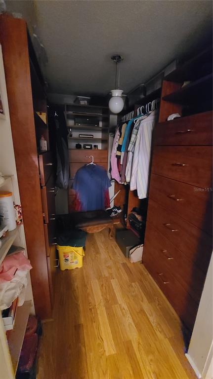501 Hermits Trail Altamonte Springs, FL 32701 - Photo 15 of 61 a view of walk in closet with clothes and shoes