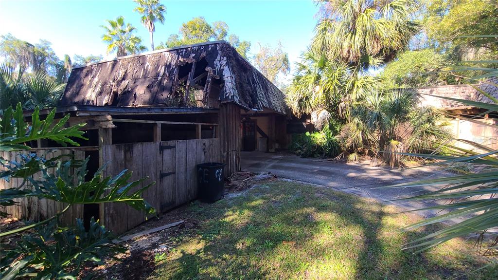 501 Hermits Trail Altamonte Springs, FL 32701 - Photo 41 of 61 a view of a house with a small yard