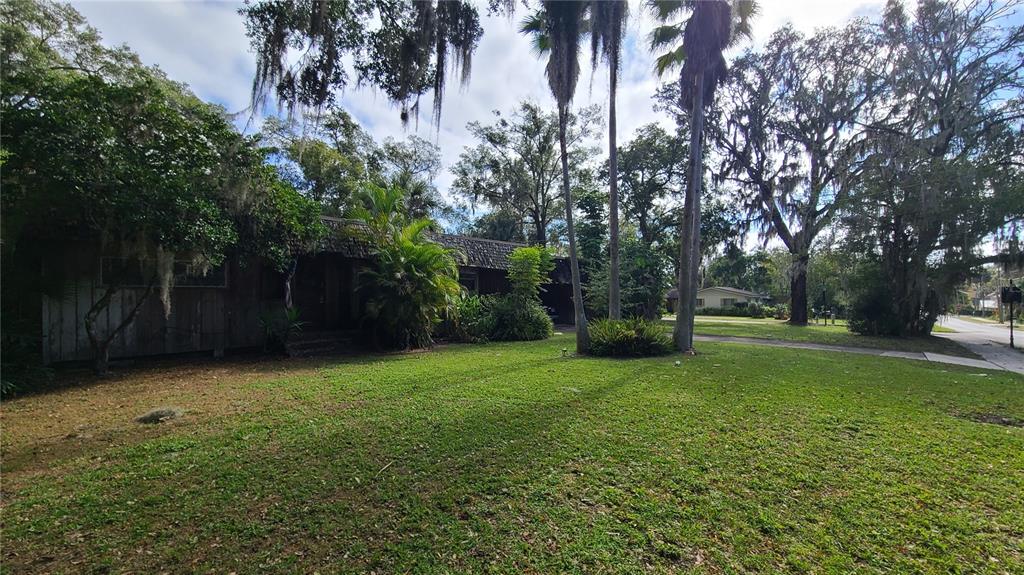 501 Hermits Trail Altamonte Springs, FL 32701 - Photo 47 of 61 a view of a backyard with large trees