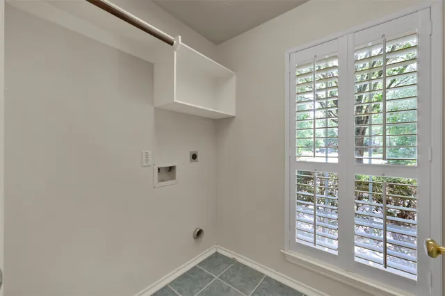 a view of empty room with windows