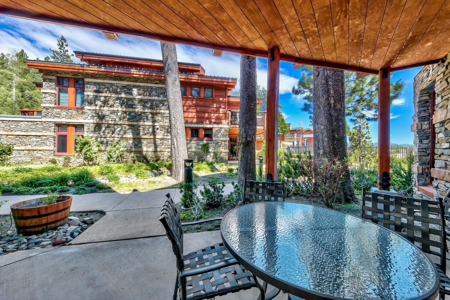 6750 North Lake Boulevard, Unit 13F Tahoe Vista, CA 96148 - Photo 17 of 20 a view of a swimming pool with outdoor seating and plants