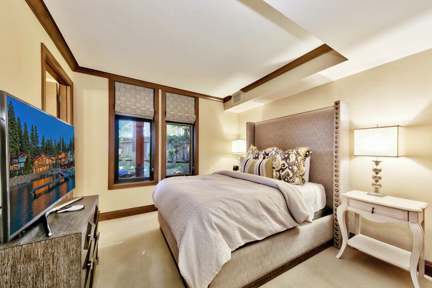 6750 North Lake Boulevard, Unit 13F Tahoe Vista, CA 96148 - Photo 6 of 20 a bedroom with a large bed and a flat screen tv