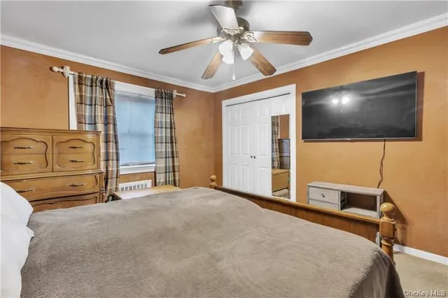 a kitchen with stainless steel appliances kitchen island granite countertop a refrigerator and cabinets