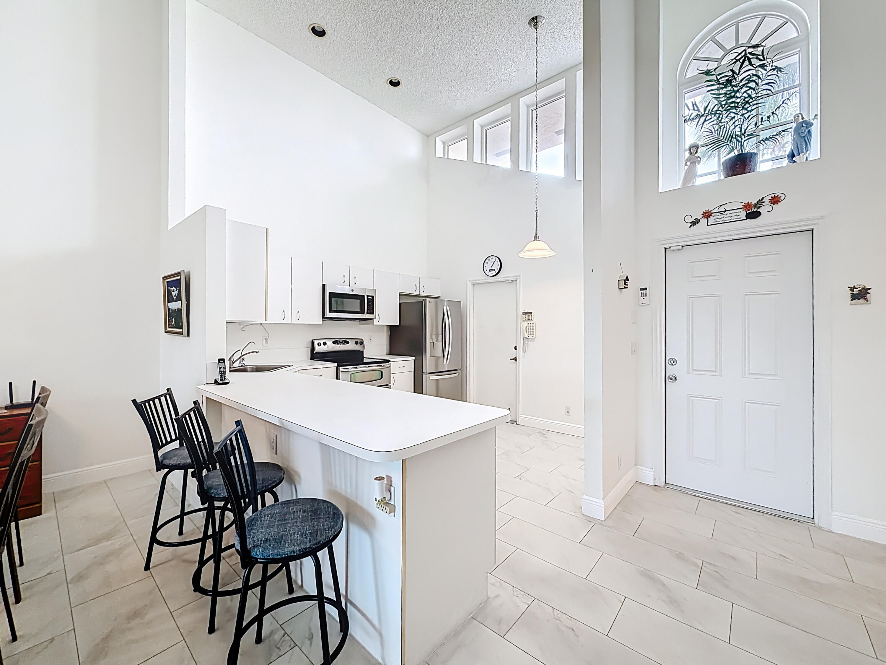 10954 Lakemore Lane Boca Raton, FL 33498 - Photo 15 of 61 a view of a dining room with furniture