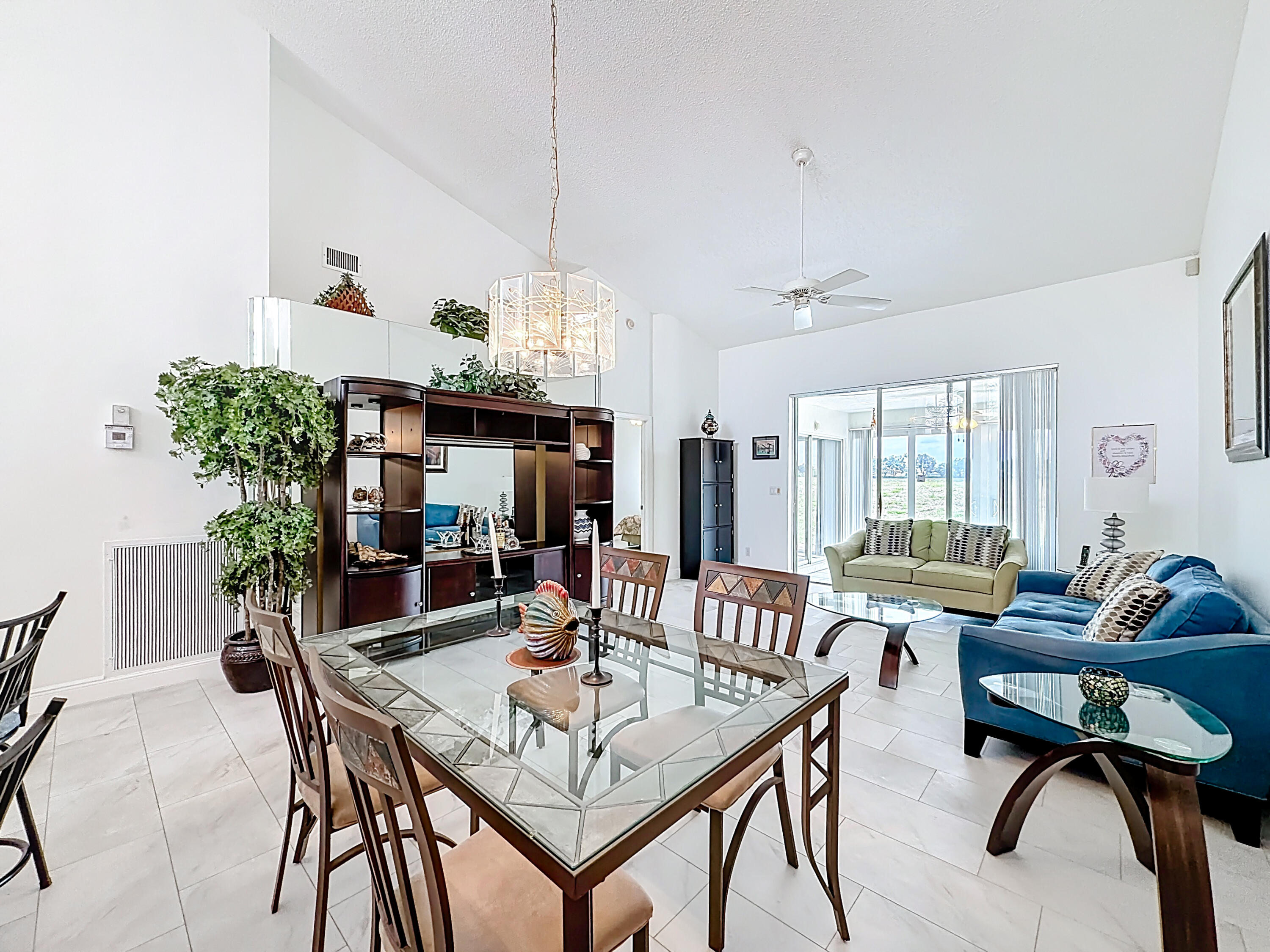 10954 Lakemore Lane Boca Raton, FL 33498 - Photo 16 of 61 a view of a dining room with furniture window and wooden floor