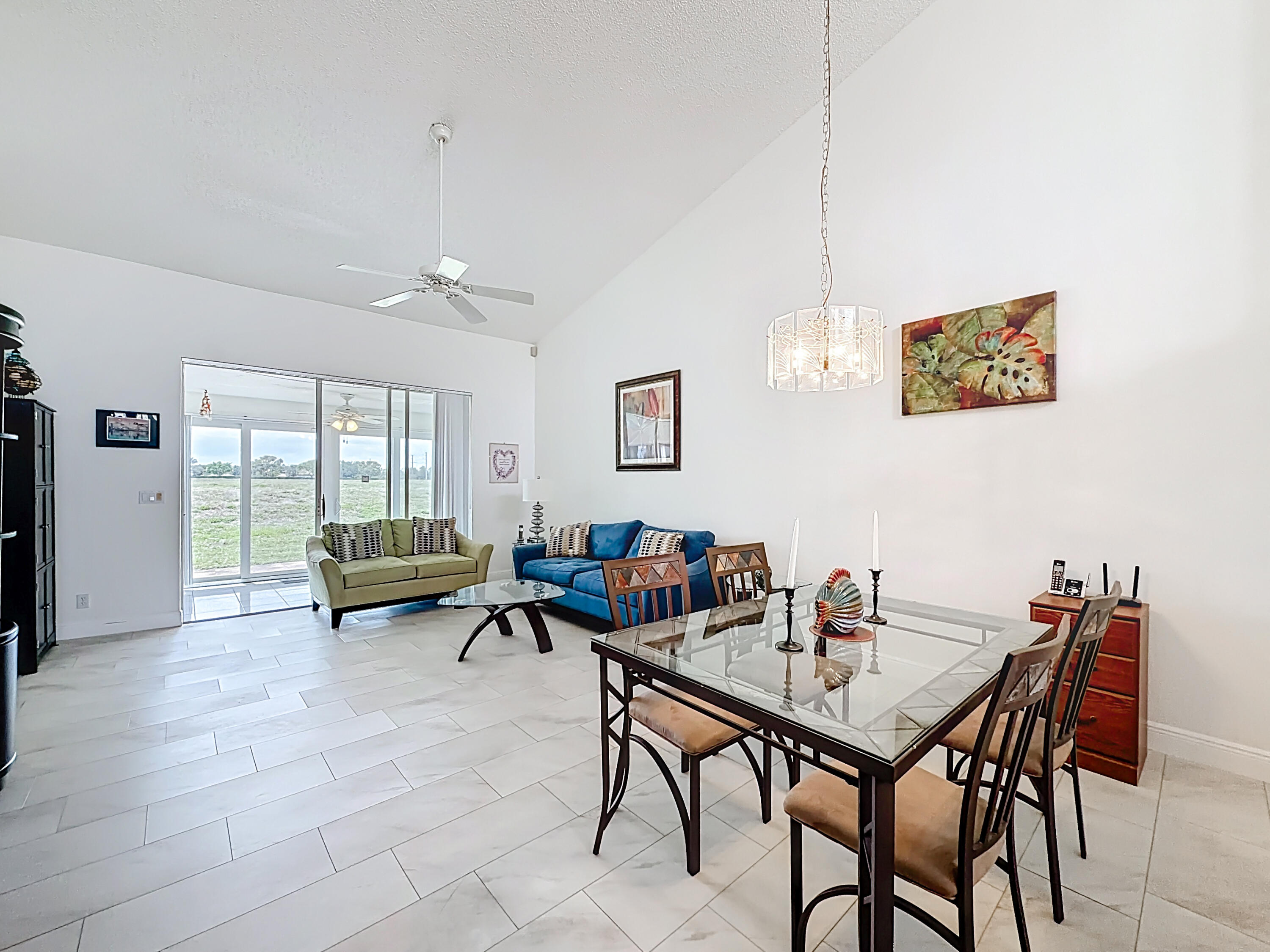 10954 Lakemore Lane Boca Raton, FL 33498 - Photo 17 of 61 a view of a dining room with furniture and wooden floor