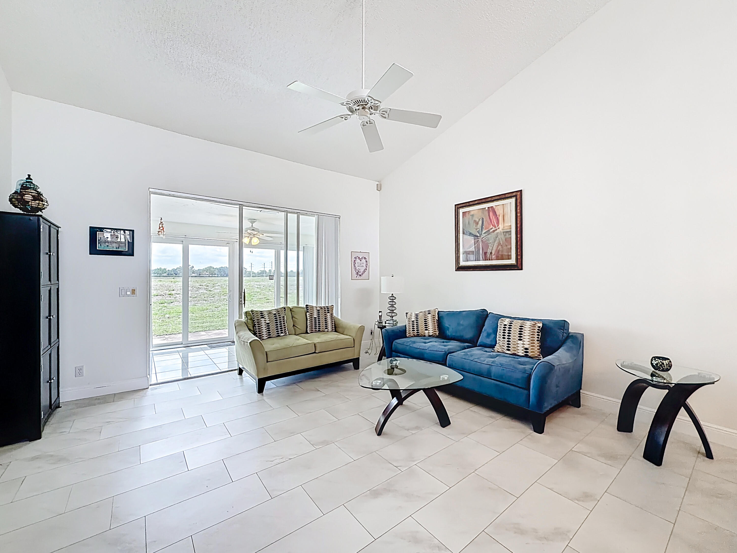 10954 Lakemore Lane Boca Raton, FL 33498 - Photo 20 of 61 a living room with furniture and a large window
