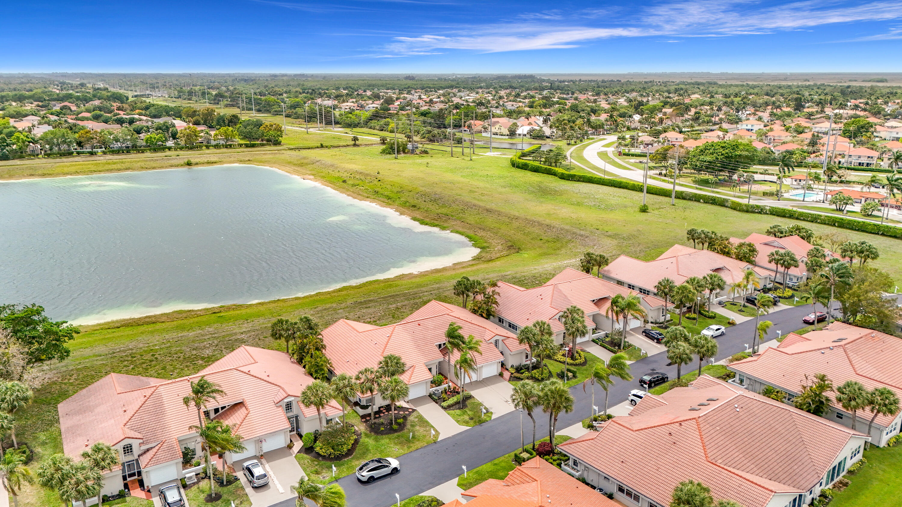 10954 Lakemore Lane Boca Raton, FL 33498 - Photo 2 of 61 an aerial view of residential houses with outdoor space