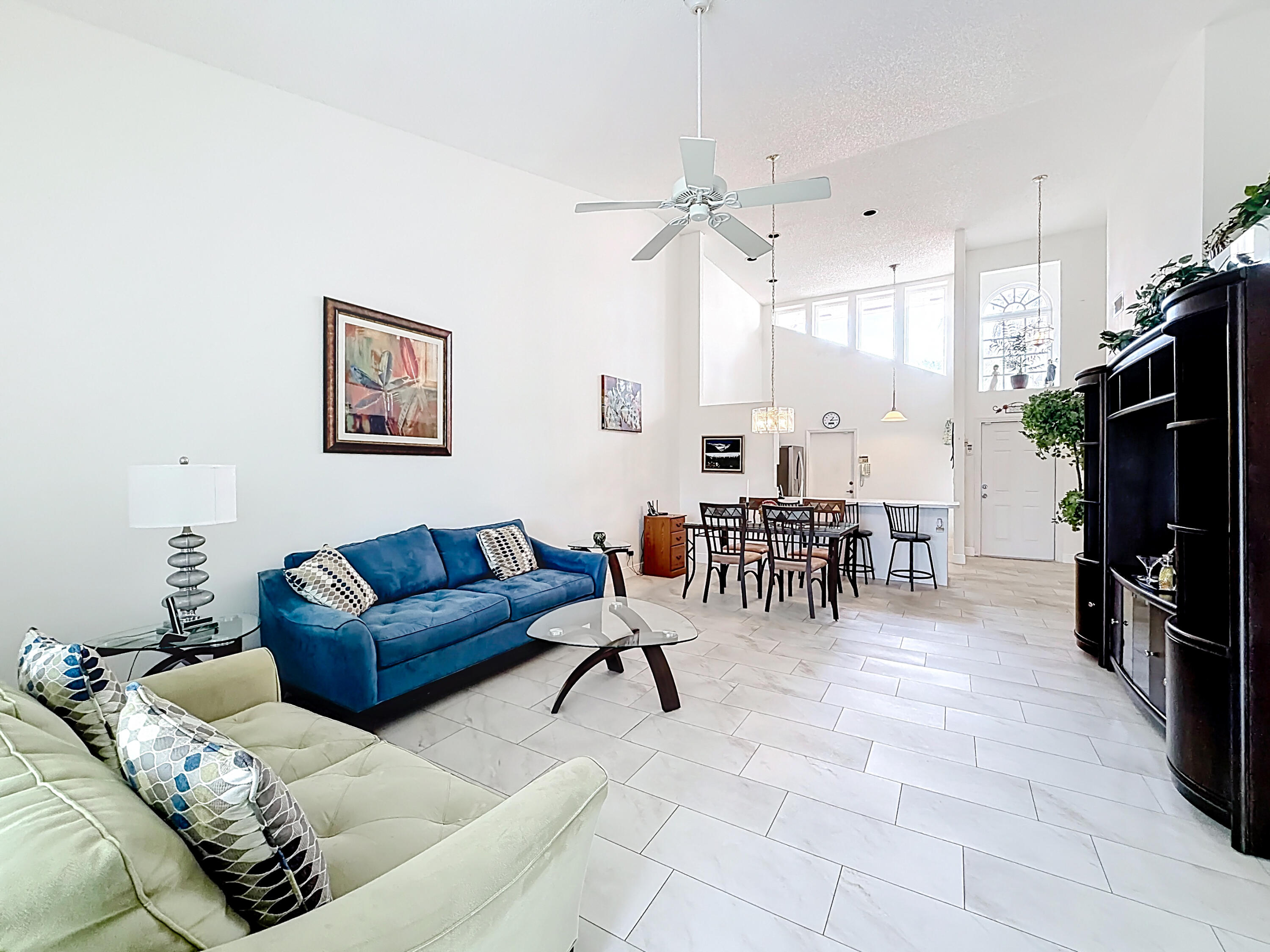 10954 Lakemore Lane Boca Raton, FL 33498 - Photo 21 of 61 a living room with furniture and a dining table with projector kitchen