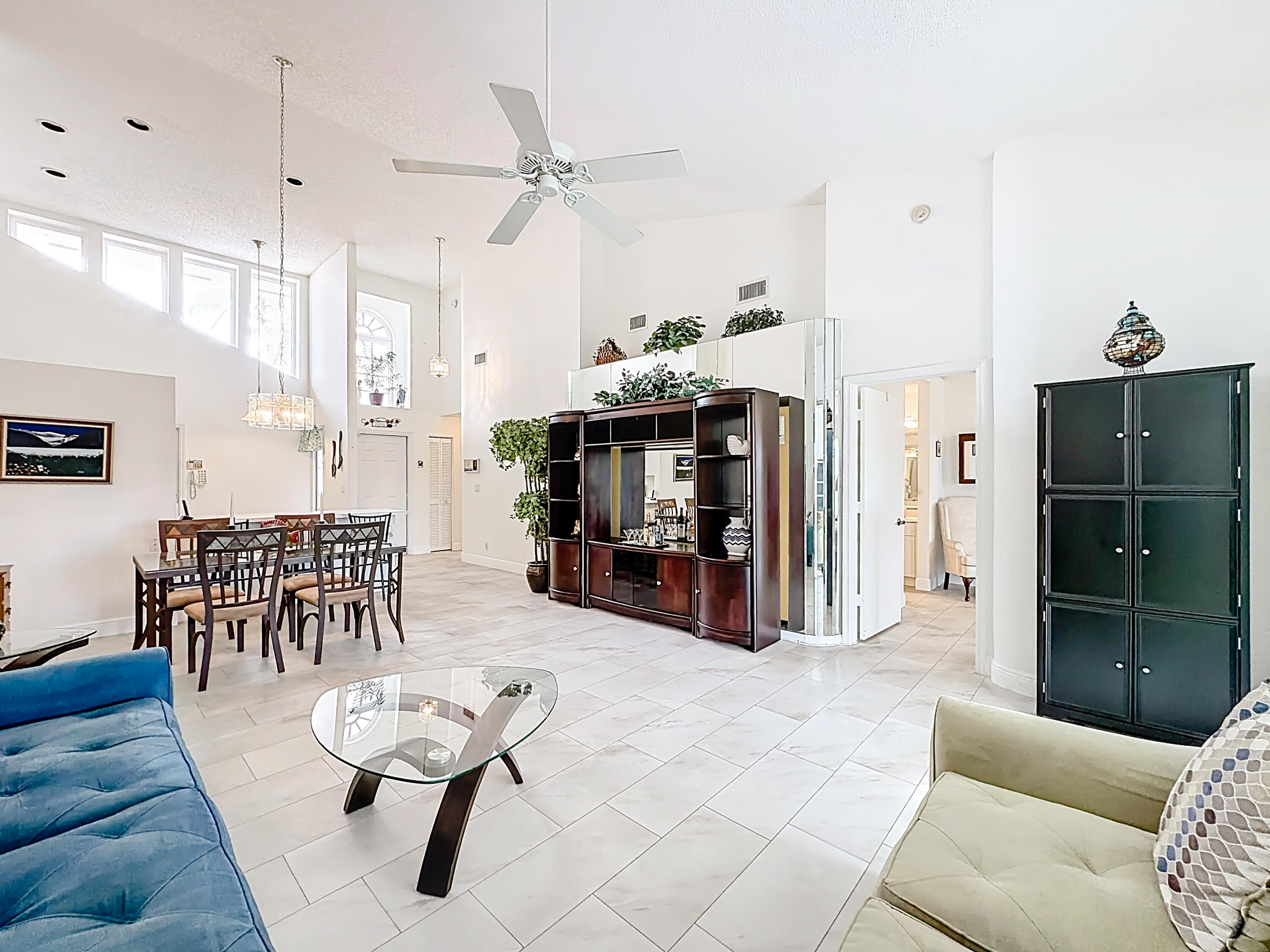 10954 Lakemore Lane Boca Raton, FL 33498 - Photo 23 of 61 a living room with furniture a dining table and chairs