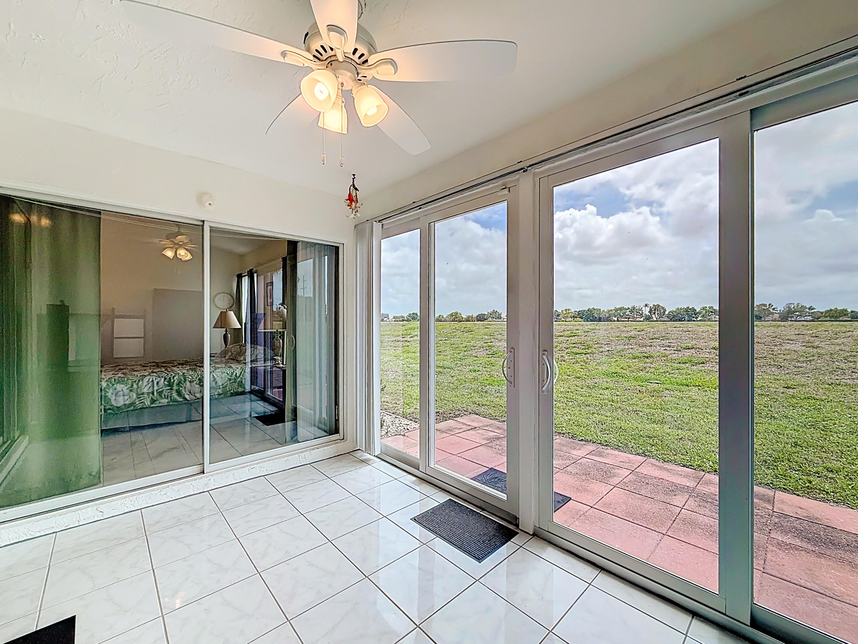 10954 Lakemore Lane Boca Raton, FL 33498 - Photo 28 of 61 a view of a room with window and ceiling fan