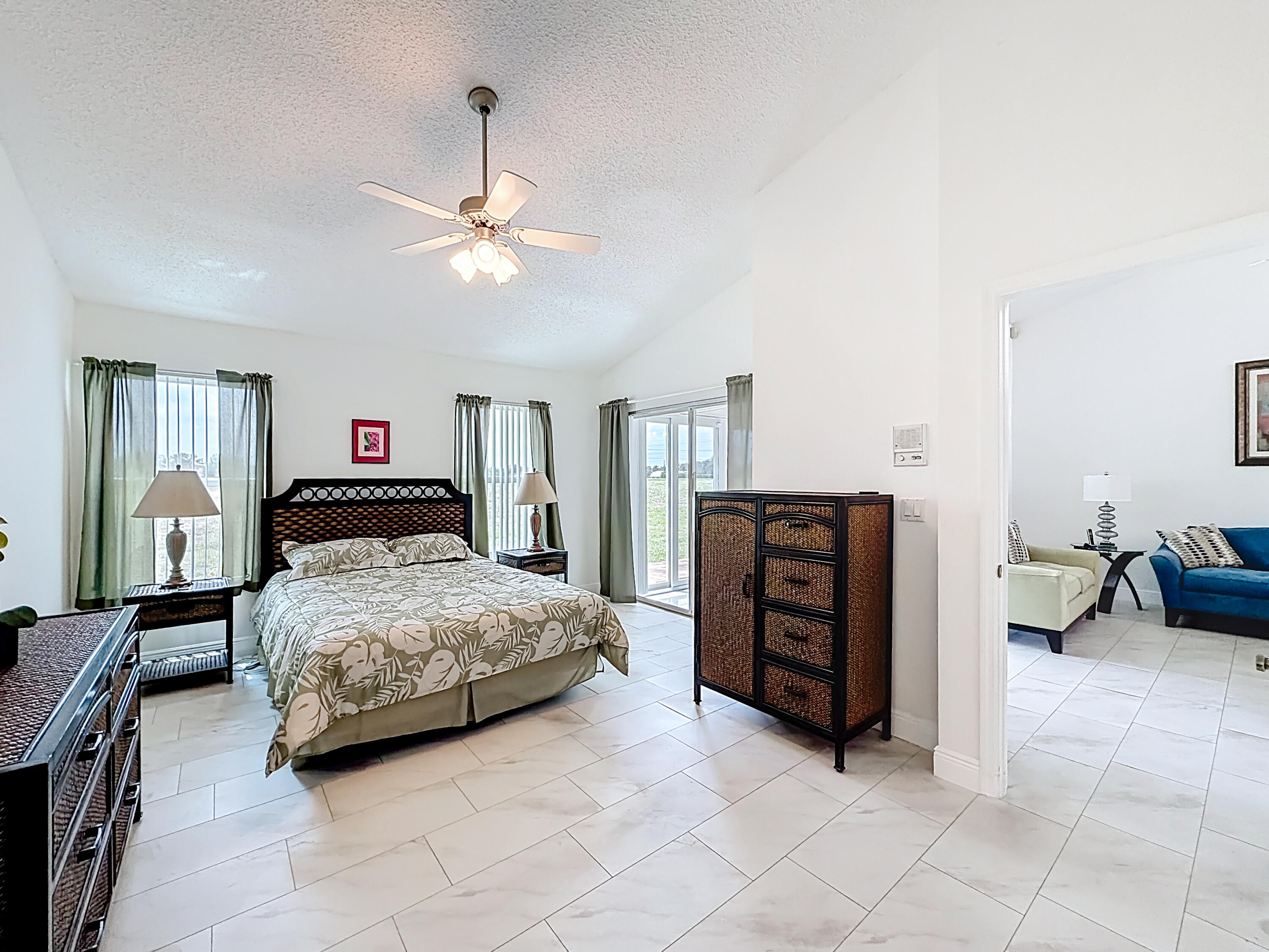 10954 Lakemore Lane Boca Raton, FL 33498 - Photo 31 of 61 a bedroom with a bed and dresser