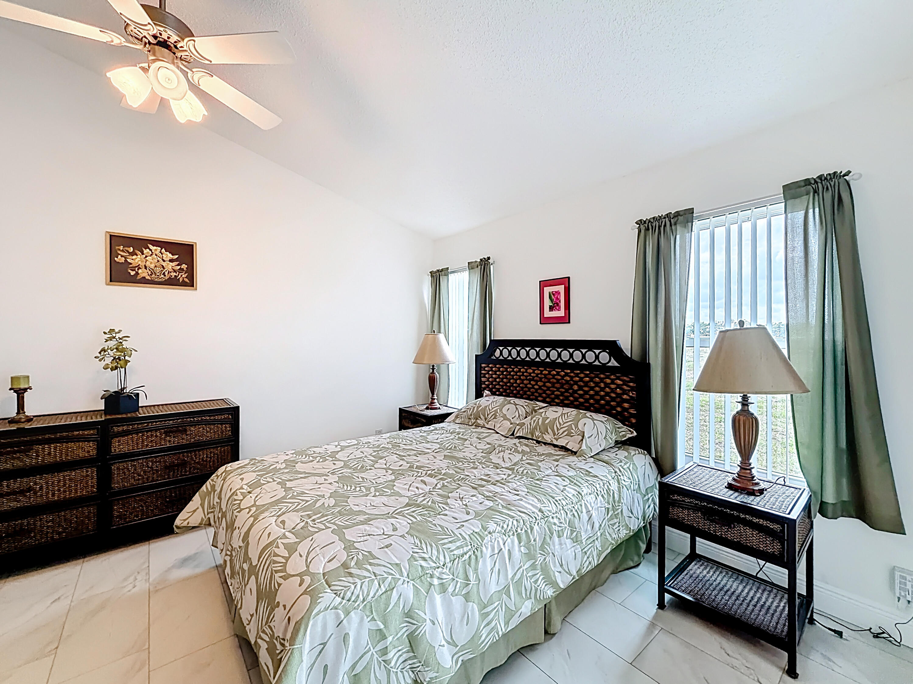 10954 Lakemore Lane Boca Raton, FL 33498 - Photo 34 of 61 a bedroom with a bed and a dresser