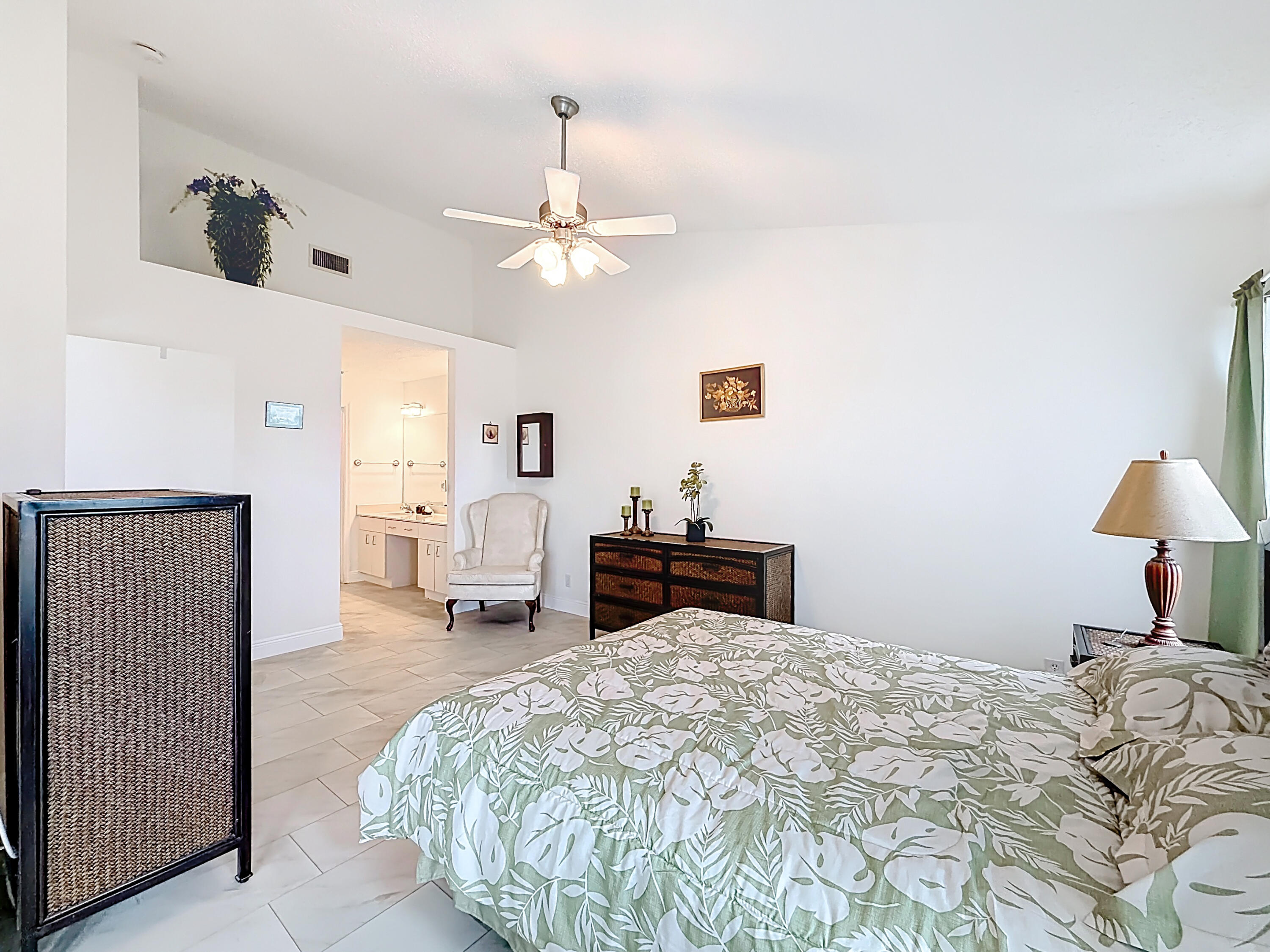 10954 Lakemore Lane Boca Raton, FL 33498 - Photo 35 of 61 a bed room with a bed and a chandelier