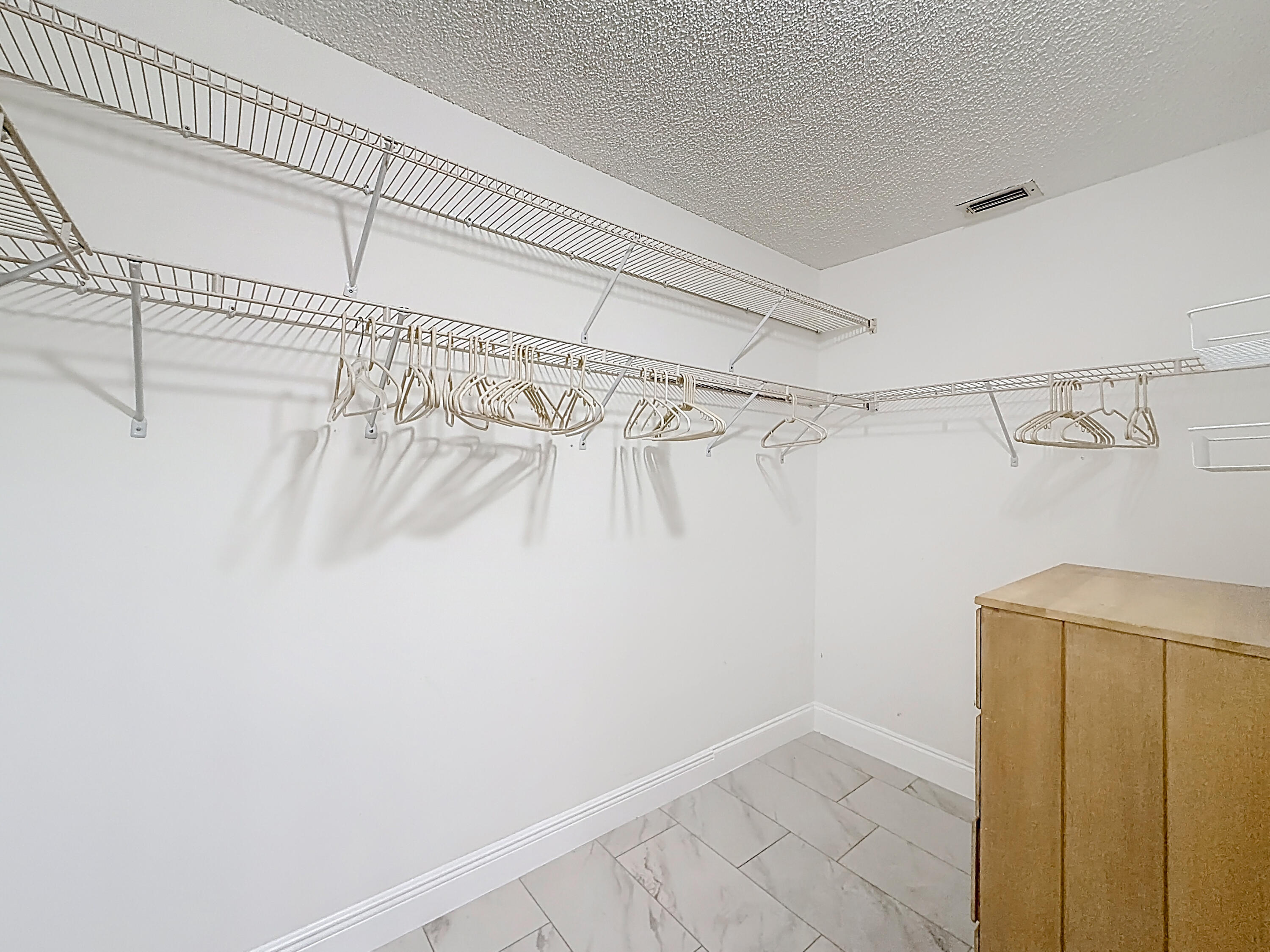 10954 Lakemore Lane Boca Raton, FL 33498 - Photo 37 of 61 a view of a room with racks on the wall