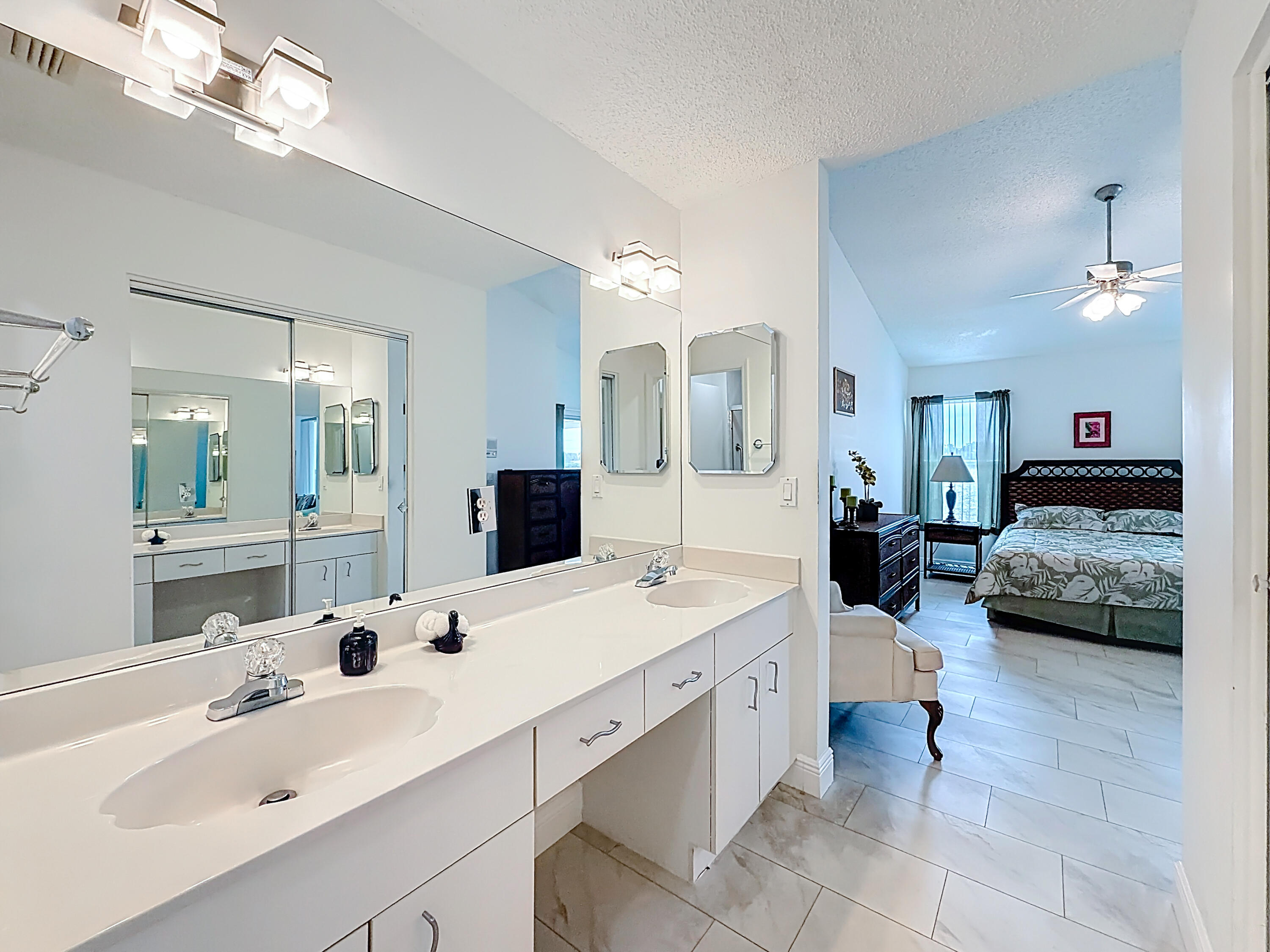 10954 Lakemore Lane Boca Raton, FL 33498 - Photo 40 of 61 a en suite bathroom with a double vanity sink double vanity and mirror