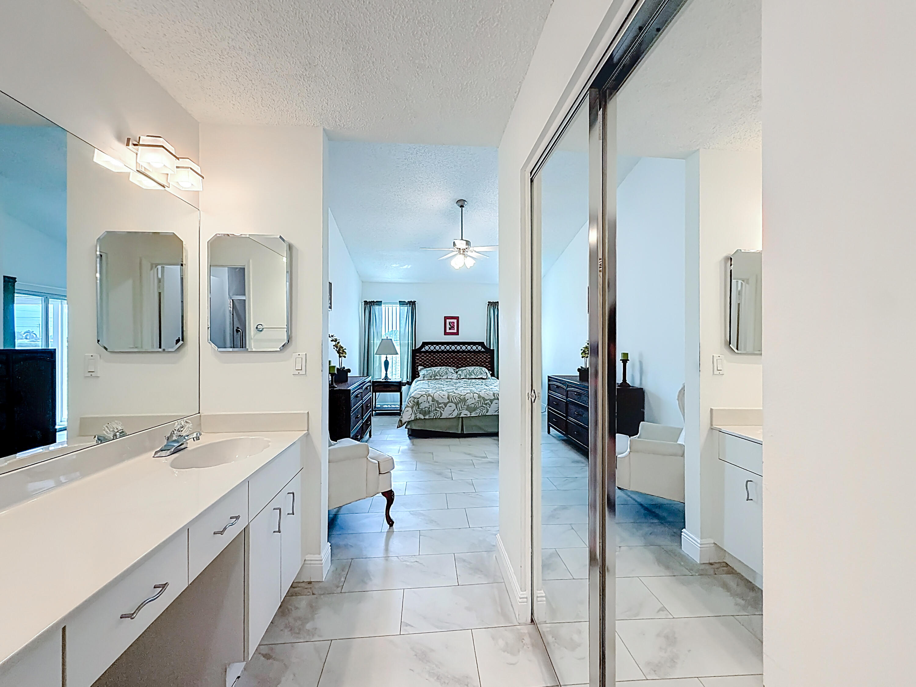 10954 Lakemore Lane Boca Raton, FL 33498 - Photo 41 of 61 a en suite bathroom with a double vanity sink and a mirror