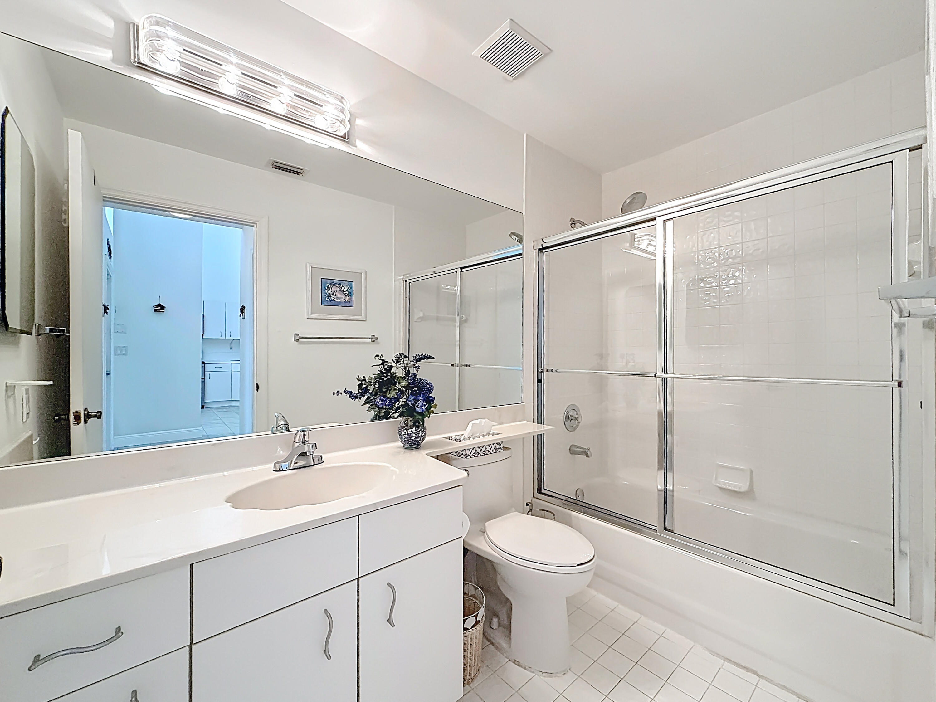 10954 Lakemore Lane Boca Raton, FL 33498 - Photo 45 of 61 a bathroom with a sink toilet and shower