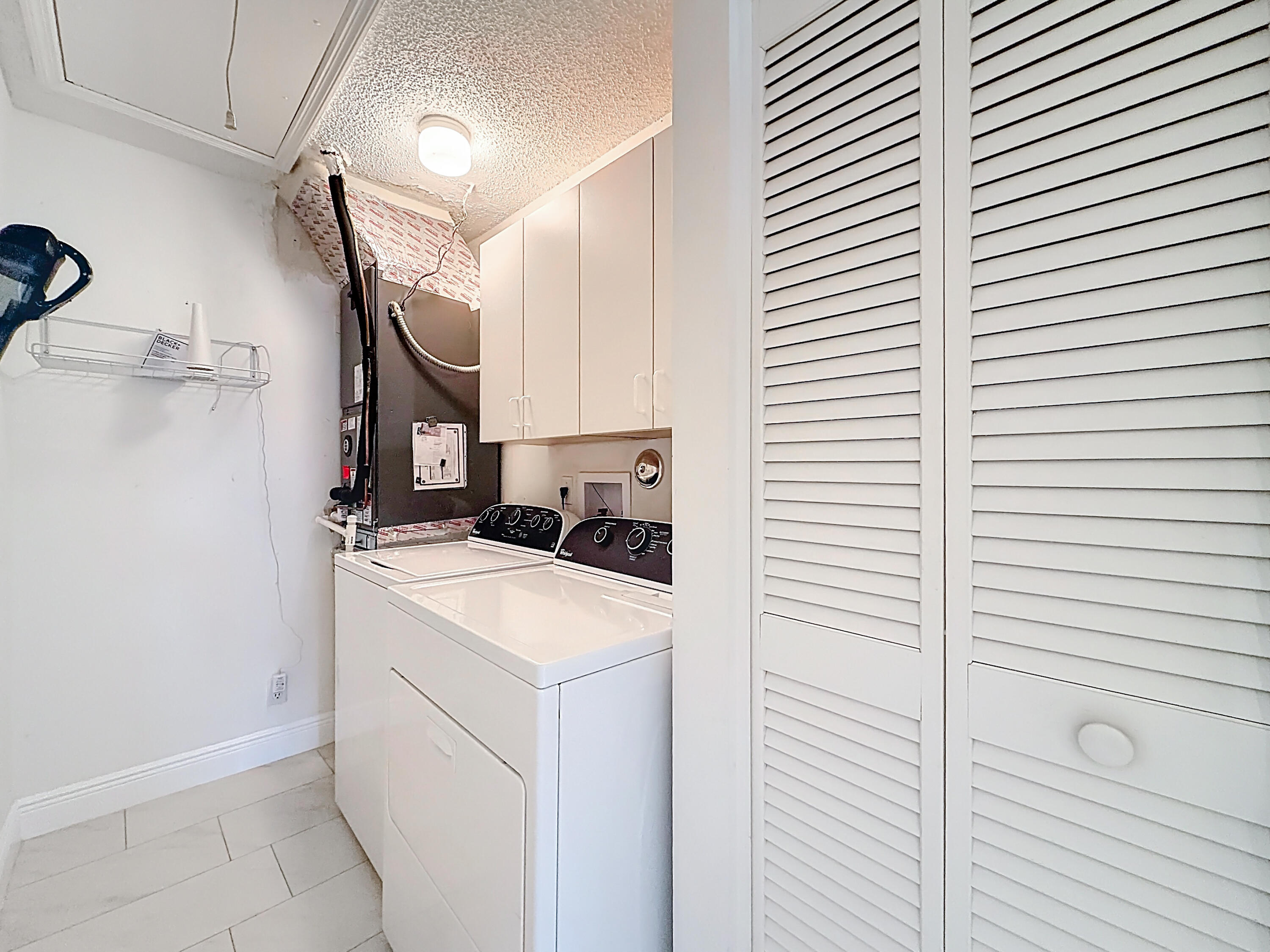 10954 Lakemore Lane Boca Raton, FL 33498 - Photo 46 of 61 a utility room with dryer and washer
