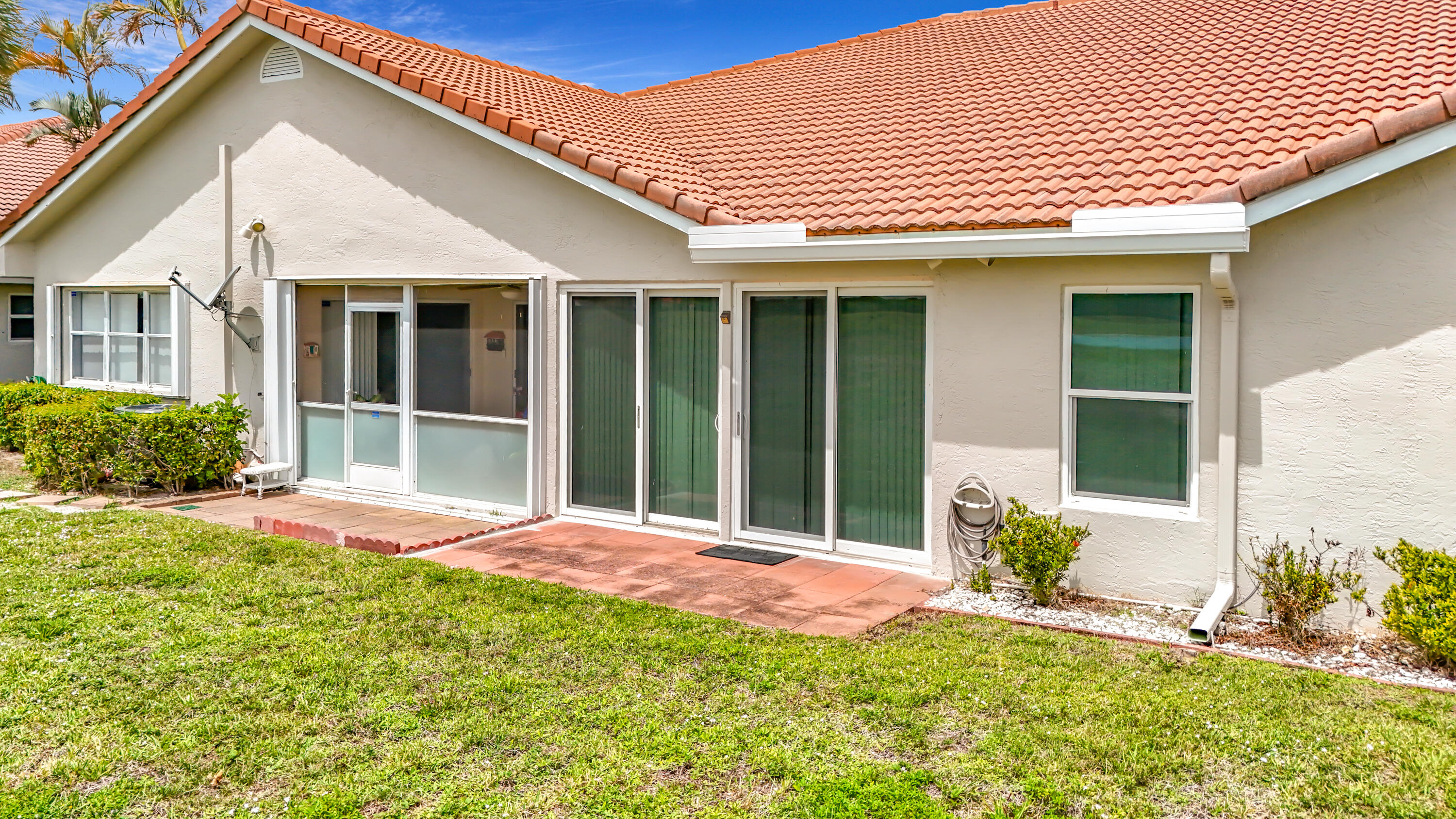 10954 Lakemore Lane Boca Raton, FL 33498 - Photo 54 of 61 front view of a house with a yard