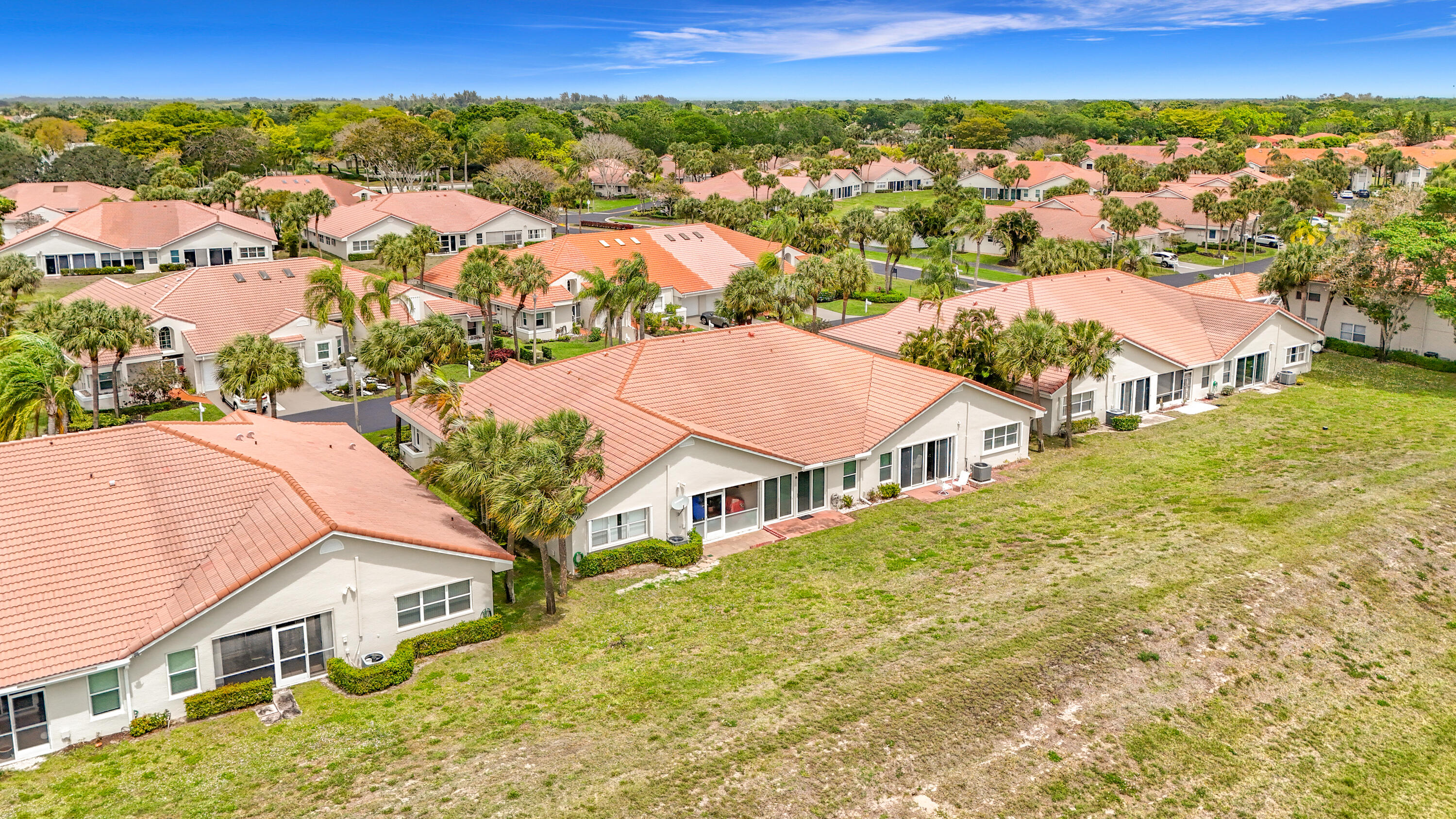 10954 Lakemore Lane Boca Raton, FL 33498 - Photo 56 of 61 an aerial view of residential houses with outdoor space and trees