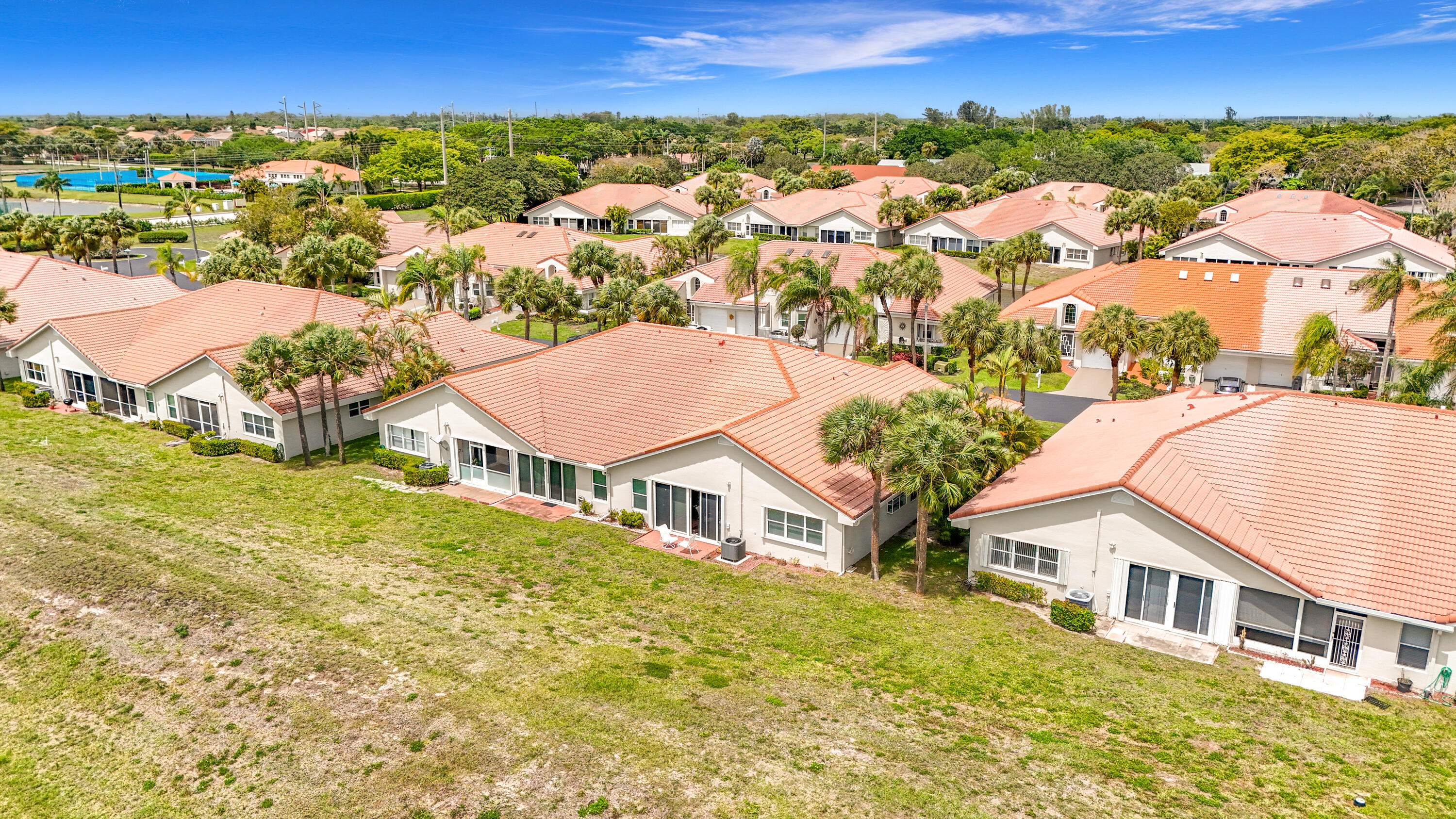 10954 Lakemore Lane Boca Raton, FL 33498 - Photo 57 of 61 an aerial view of residential houses with outdoor space and trees