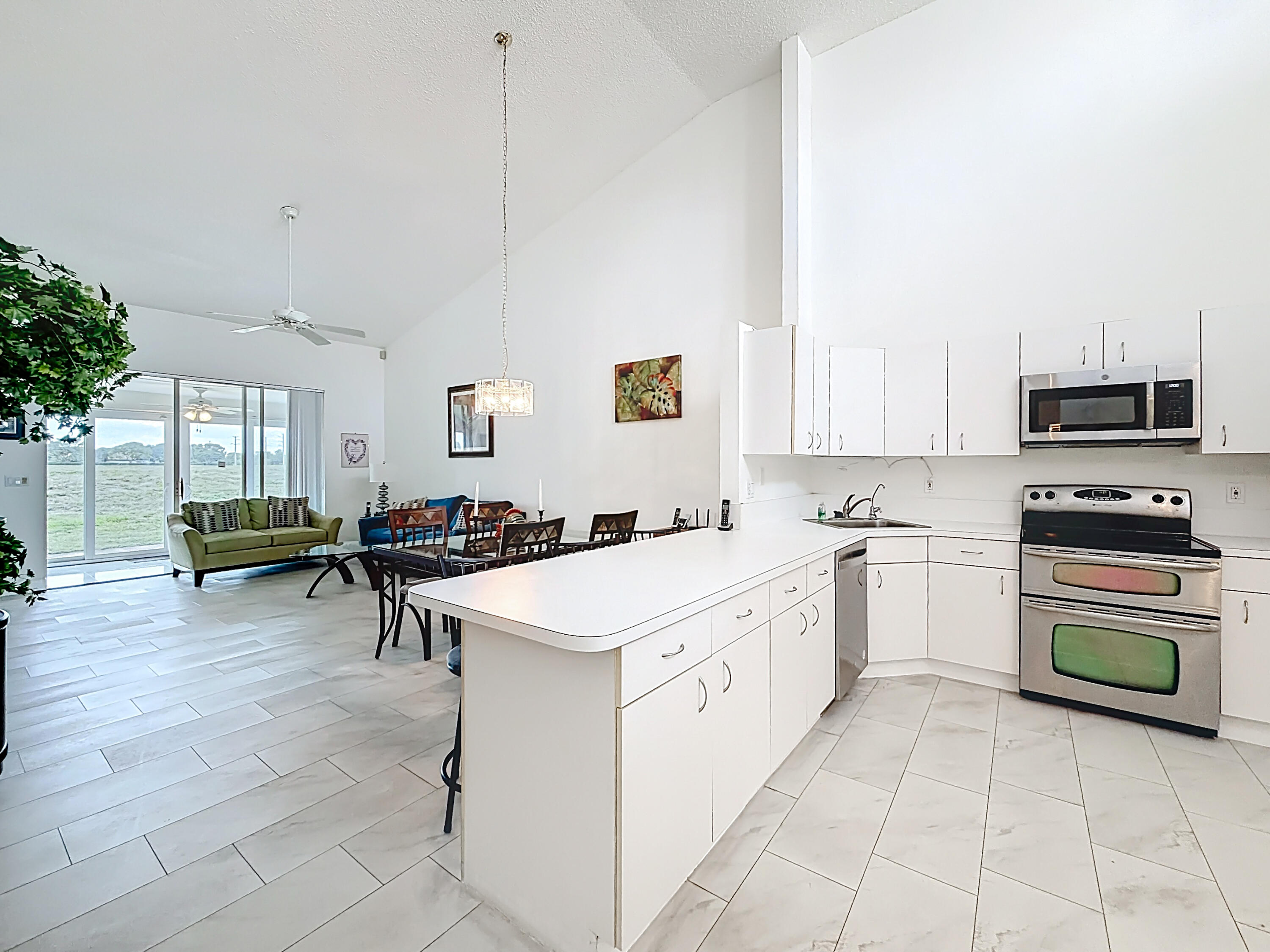 10954 Lakemore Lane Boca Raton, FL 33498 - Photo 8 of 61 a kitchen with counter top space and appliances