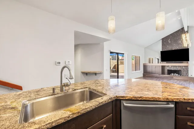 a utility room with sink dryer and washer