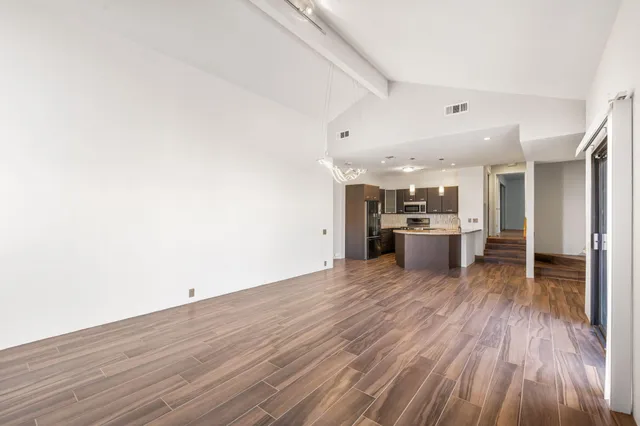 a kitchen with granite countertop a sink and a granite counter top