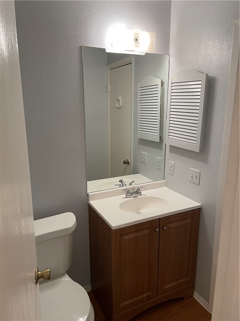105 Meteor Drive, Unit A Austin, TX 78745 - Photo 15 of 23 a bathroom with a sink toilet and mirror