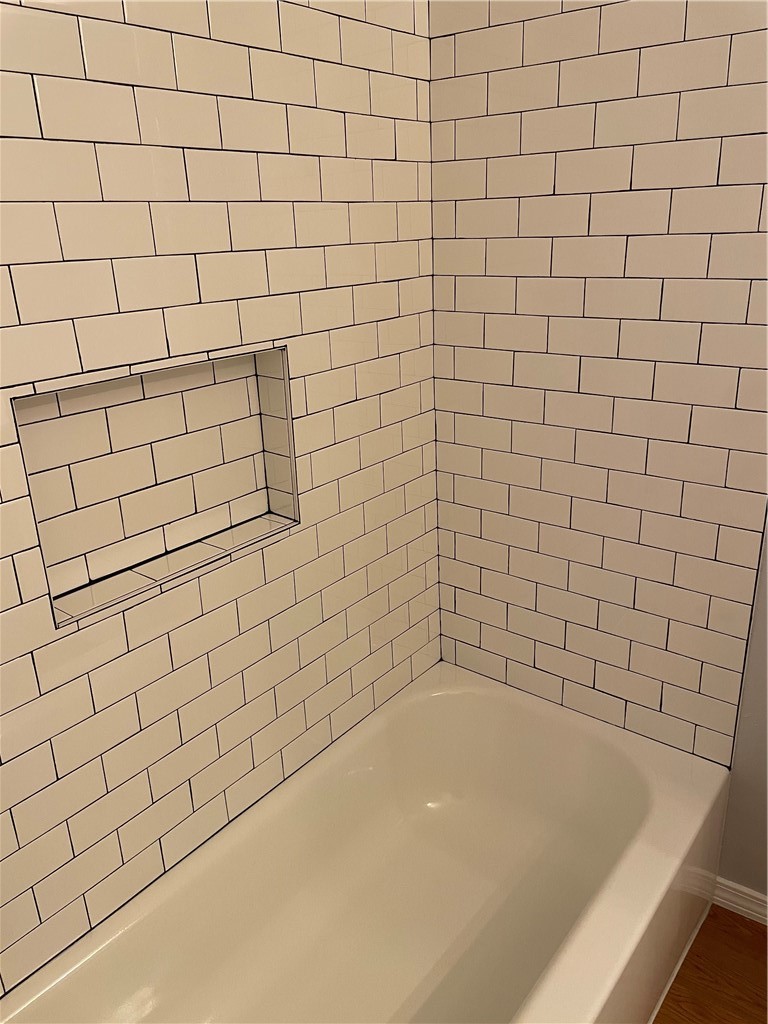 105 Meteor Drive, Unit A Austin, TX 78745 - Photo 17 of 23 a bathroom with a bathtub